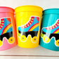 ROLLER SKATE PARTY Cups - Roller Skating Birthday Cups Skate Party Favors Skating Party Cups Roller Skating Birthday 80&#39;s Birthday Party

May include: Three plastic cups with roller skate designs. The cups are pink, yellow, and teal. Each cup has a sticker of a blue roller skate with a rainbow stripe and black wheels. The roller skate has a green lace and a yellow tongue.