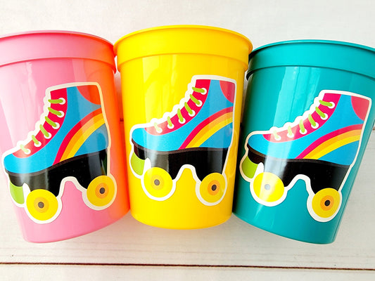 ROLLER SKATE PARTY Cups - Roller Skating Birthday Cups Skate Party Favors Skating Party Cups Roller Skating Birthday 80&#39;s Birthday Party

May include: Three plastic cups with roller skate designs. The cups are pink, yellow, and teal. Each cup has a sticker of a blue roller skate with a rainbow stripe and black wheels. The roller skate has a green lace and a yellow tongue.