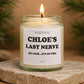 Personalized Last Nerve soy candle in a clear glass jar with a clean white label featuring bold black text that reads a custom name followed by “Last Nerve” and the phrase “Oh look… it’s on fire.” The candle is lit with a small flame and sits on a natural stone surface with soft greenery in the background. This funny scented candle makes a perfect gift for her or him, ideal for Christmas, birthdays, coworkers, friends, or anyone who loves sarcastic humor and modern home decor.