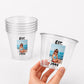 May include: Clear plastic cups with a photo of a young girl on the beach, the text "EST. 1994" is printed on the cups. One cup is stacked with others, and another is held by a hand.