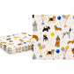 May include: A stack of square paper napkins with scalloped edges, featuring a repeating pattern of various dog breeds wearing party hats and bandanas, interspersed with colorful balloons and small gold dots on a white background.