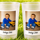 May include: Two frosted plastic cups featuring a rectangular photo print of a toddler wearing a blue long-sleeve shirt and blue jeans, sitting next to a yellow toy dump truck. Below the photo, the text Vintage 2000 is printed in black.