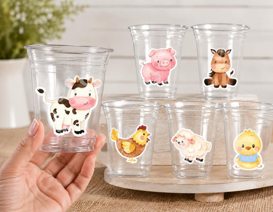 May include: Clear plastic cups decorated with farm animal stickers, including a cow, pig, horse, chicken, sheep, and chick. The stickers are colorful and cartoon-like, with a white background.