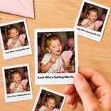 May include: A collection of square instant film photographs featuring a young child with blonde hair wearing a pearl necklace, holding a heart-shaped mirror and applying lipstick. Each photo includes the printed text Look Who's Getting Married.