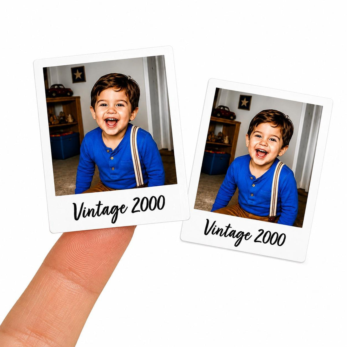May include: Two white polaroid-style stickers with a photo of a smiling child wearing a blue shirt and suspenders. The text "Vintage 2000" is printed in black cursive font at the bottom of each sticker.